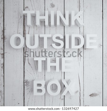 think outside the box on a wood wall