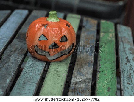 Decorative pumpkin on a wooden table