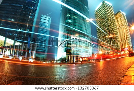 the light trails on the modern building background in shanghai china Royalty-Free Stock Photo #132703067