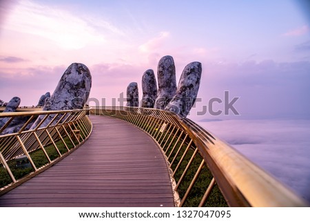 The Golden Bridge at Bana Hills,Da Nang,Vietnam, known as “Hands of God”, a pedestrian footpath lifted by two giant hands
 Royalty-Free Stock Photo #1327047095