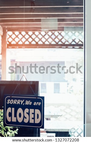 Sorry we are closed sign hanging on the door