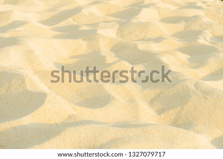 Close up fine beach sand in the summer sun. Soft texture beach sand