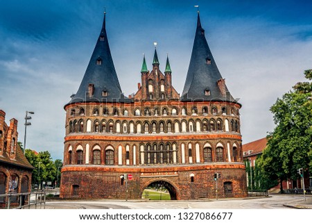 Holsten Gate in Lubeck old town, Germany. The Holsten Gate (Holstentor) in Lubeck old town, Schleswig-Holstein region, Germany Royalty-Free Stock Photo #1327086677