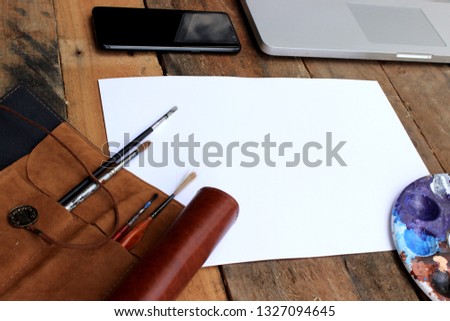 Water Color Painting Mockup Desktop rustic wooden table. Image shot from above in flat lay style. colour 