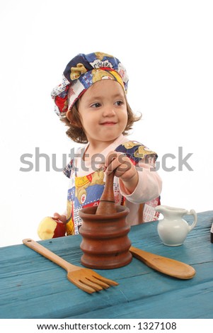 Cute toddler cooking dressed as a chef. More pictures of this baby at my gallery