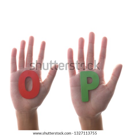 colored wood alphabet on palm