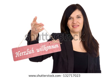 Woman and sign with the german word cordially welcome
