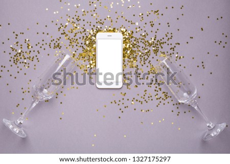 Mobile phone with golden stars confetti on pink color paper background minimal style ,color of 2021 year Ultimate Gray  and Illuminating