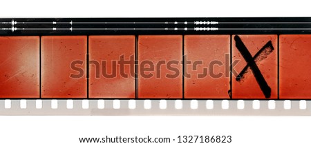 old and empty 16mm film movie strip on white background