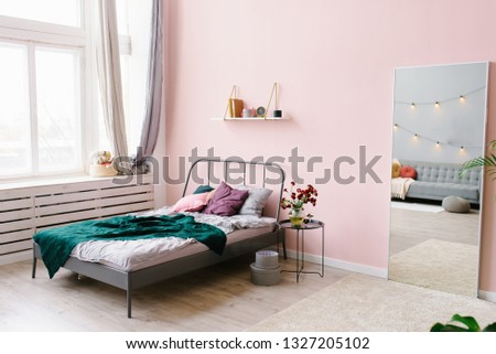 Bed with pillows and a blanket. Bedroom interior Royalty-Free Stock Photo #1327205102