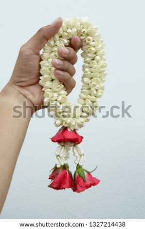 Jasmine and rose garland in the hand