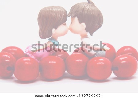 Background for postcards, Declaration of love, kiss of two lovers, red beads