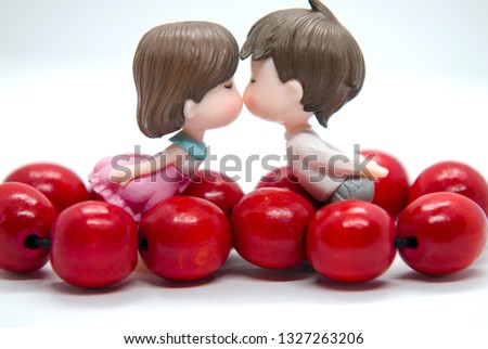 Background for postcard, Declaration of love, kiss of two lovers, red beads