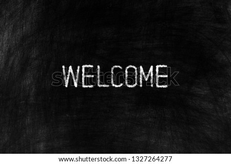 Welcome on Black Chalkboard Background, Suitable for Business Concept.