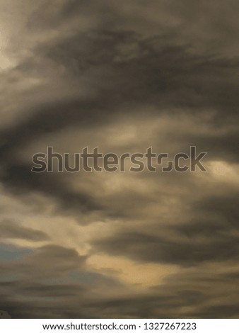 piece of blue sky practically covered by stormy clouds in swirl, sao paulo, brazil