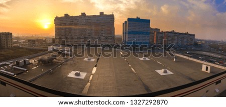 cityscape panorama with high houses at sunset