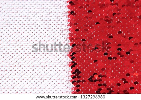 white and red sequins on the fabric. background texture