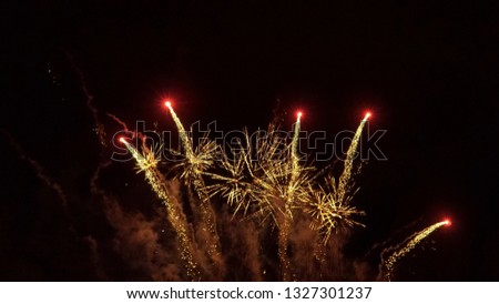 Colorful fireworks at night. The spectacular firecracker. The picture for a greeting card template with a black background.