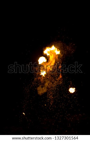 Sparks and flame on a black background