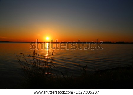 Superb sunset with a beautiful sky on the river. Sunset in nature