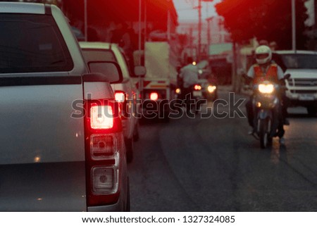 Pick up car silver color on the road at evening on rush hours in Thailand. Open light break.