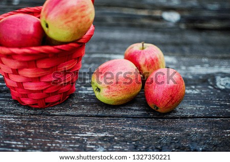 Apples on a limited background in the basket and juice