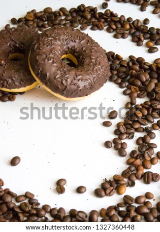 Coffee beans and donuts background