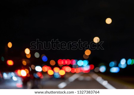 Colorful Blurred Lights out of focus picture of the street with cars at night