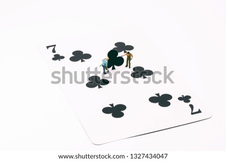Gardener planting trees on playing cards