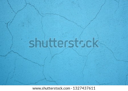 Cracked wall background. Blue background