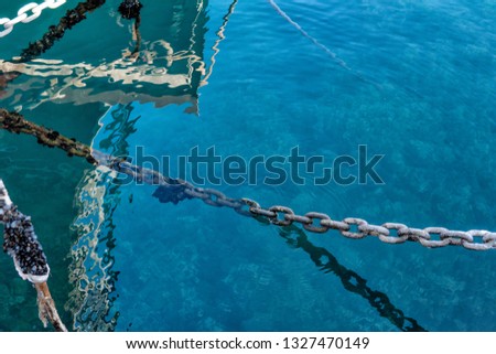 old rusty metal chain on a pier on the Adriatic coast
