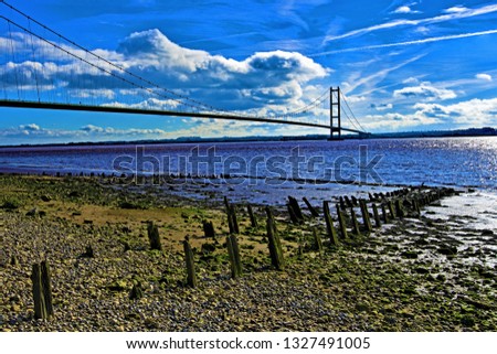 Taken to capture the Humber Bridge and the Humberside Estuary, on a bright sunny day, in March 2019.  Royalty-Free Stock Photo #1327491005