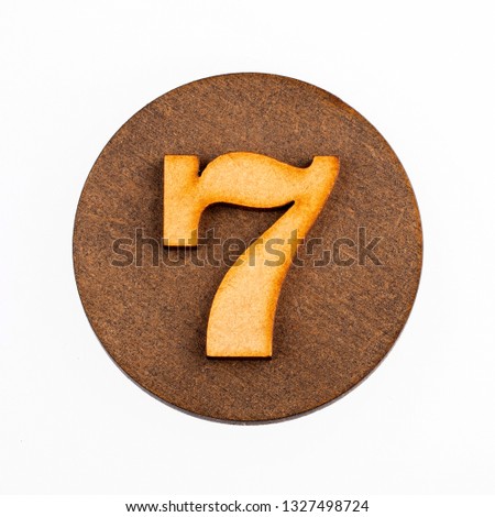 Number 7 in a wooden circle