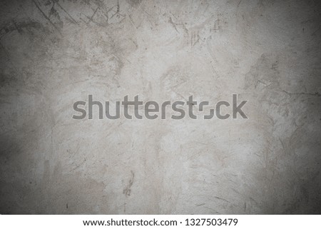 Vignetted concrete wall texture background.