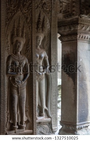 Detail of the figures carved in the columns of Angkor Wat, Cambodia
