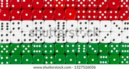 National flag of Hungary in colorful background of dices