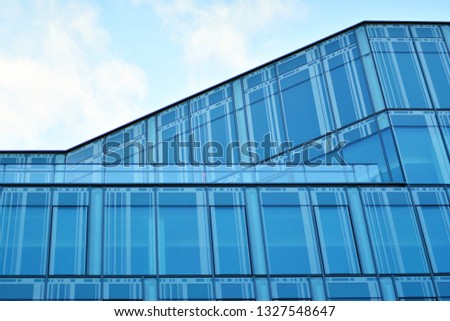 Blue clean glass wall of modern office building
