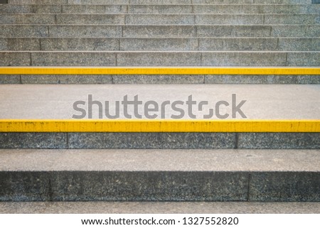 yellow warning line on stairway, urban signage example, Warsaw, Poland
