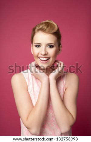 Pretty young woman isolated on pink smiling