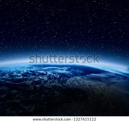 Blue earth from space. Outer space view. Atmosphere, clouds and star. Elements of this image furnished by NASA.