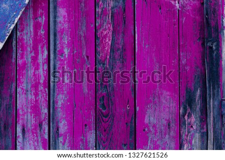 Abstract woody background with cracked from age paint. Purple toning. Violet shade. Free space for inscriptions.