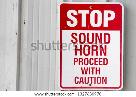 Red and White Sign Stop Sound Horn Proceed with Caution