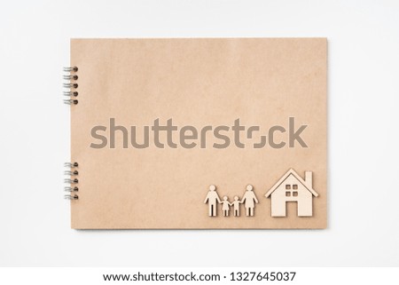 Design concept - Top view of kraft notebook with family concept on white background for mockup