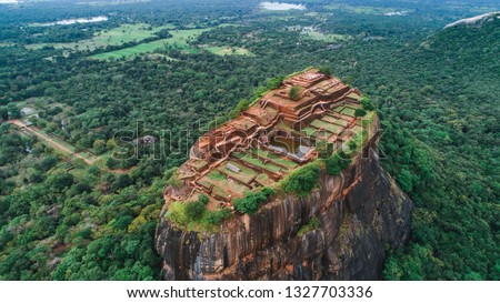 Sigiriya Lion's Rock of Fortress in the middle of the forest in Sri Lanka island Royalty-Free Stock Photo #1327703336