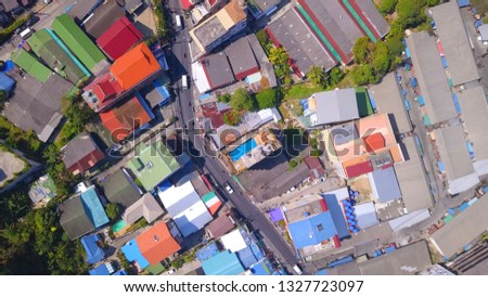 Drone fly down above the  road junction and streets at Patong,Phuket island,Thailand,zoom shot