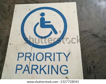 Priority parking sign. Parking area fordDisability.