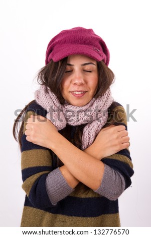 Adult woman freezing in the cold, isolated on white background.