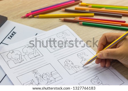 Storyboard drawing with pencil creative sketch cartoon. Storyboarding is process image displayed in sequence for purpose of pre-visualizing motion picture, interactive media. Concept sketching ideas.