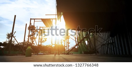 Backlit photos of construction in the time of sunset