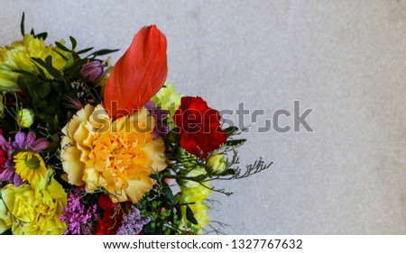 Bright colored spring bouquet on a light background, with a place for text.